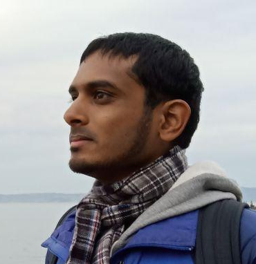 Journalist Nithin Coca, face shot, with ocean in the background